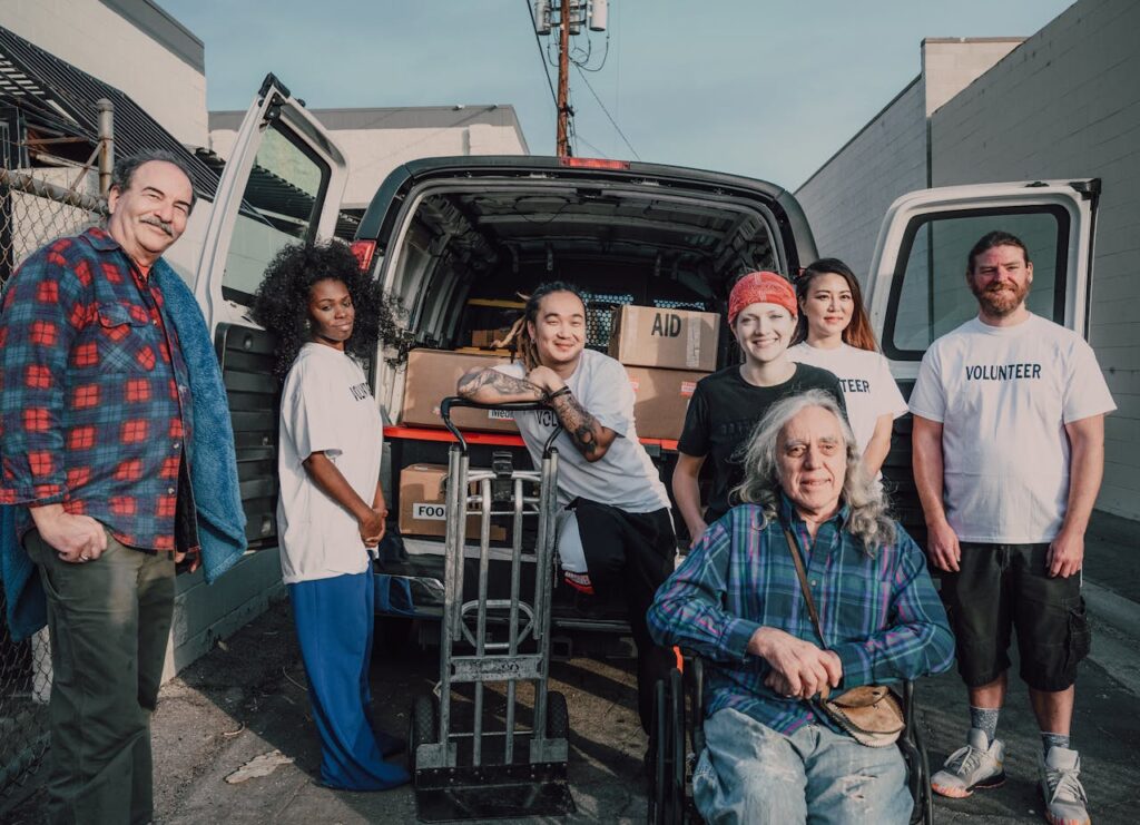 Mastering the First Impression: Your intriguing post title goes here A diverse group of volunteers packing aid supplies into a van for donation.
